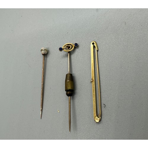 449 - 9ct gold bar brooch, 9ct gold stick pin and a 9ct gold topped hat pin