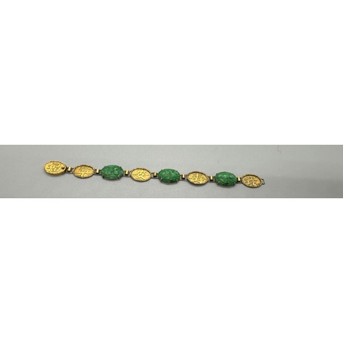 447 - Chinese 18ct gold and jade bracelet