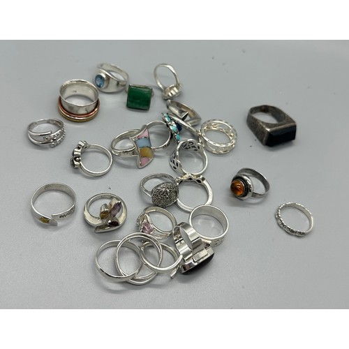 469 - Selection of silver rings includes topaz, enamel, garnet etc