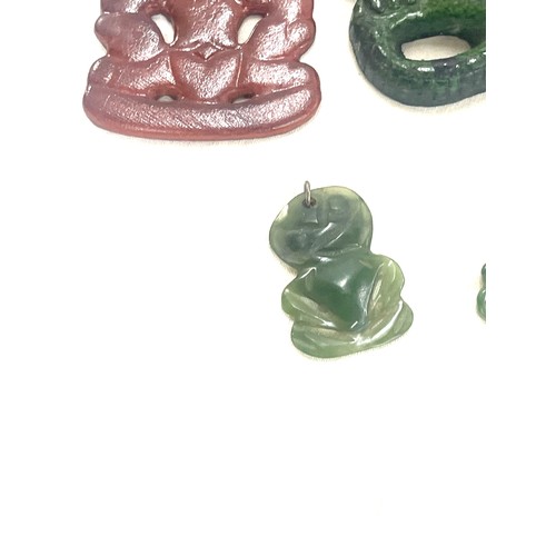 553 - Two vintage Nephrite Jade New Zealand Maori Tikis and 2 others