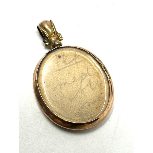 175 - 9ct gold early 1900's locket with photo (2g)