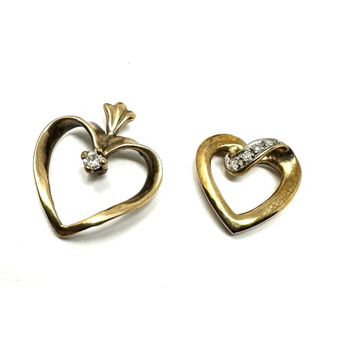 104 - 2x 9ct gold diamond heart shaped pendants (1.8g)