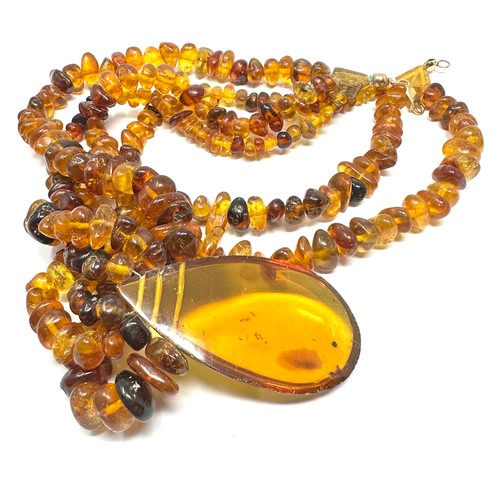 138 - 9ct gold baltic amber necklace (0.8g)