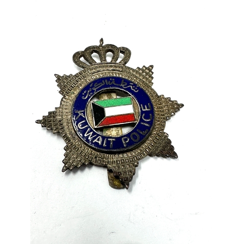 404 - 4 police cap helmet badges inc kuwait-bahamas jamaica -newzealand