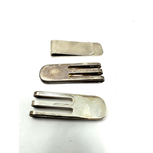 66 - 3 silver money clips