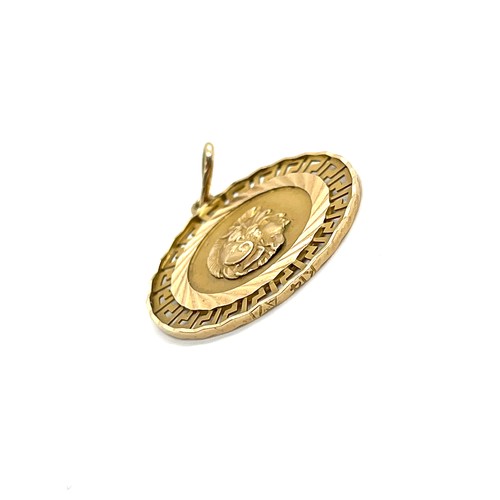 485 - 14ct gold pendant, Colosseum design, diameter of pendant 2.5cm, overall weight 3.2g