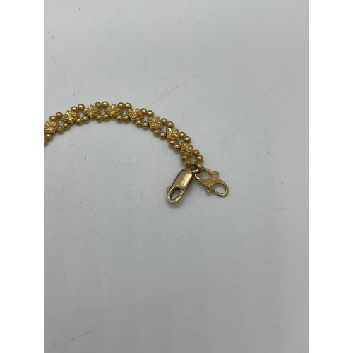 508 - 22ct gold ladies bracelet, with a repaired clasp which is 9ct gold, overall weight 12.4g, length 20c... 