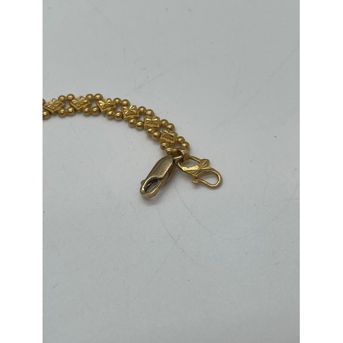 508 - 22ct gold ladies bracelet, with a repaired clasp which is 9ct gold, overall weight 12.4g, length 20c... 