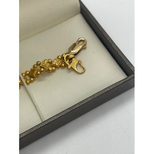 508 - 22ct gold ladies bracelet, with a repaired clasp which is 9ct gold, overall weight 12.4g, length 20c... 