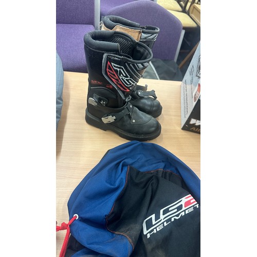 228 - Selection of motorbike accessories includes boots Helmets, trousers etc