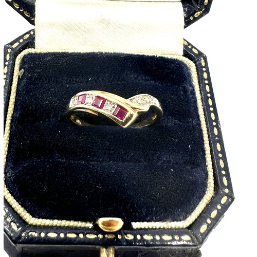 118 - 9ct gold diamond & ruby chevron ring (2.1g)