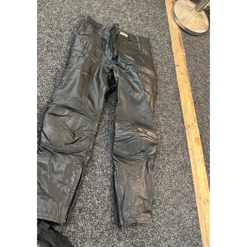 261 - Selection of motor bike shoes and trousers to include Ashman