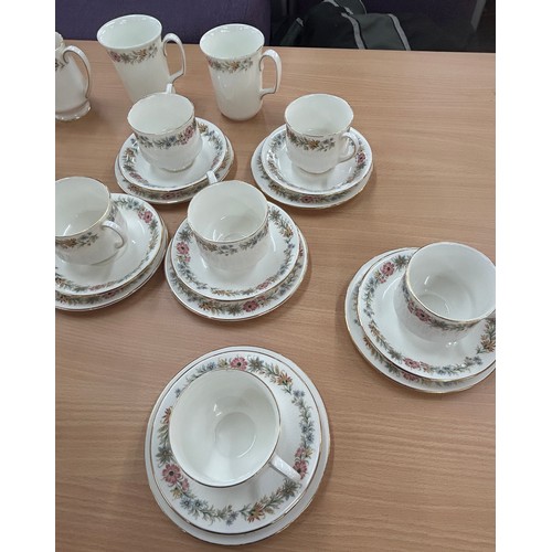 557 - Royal Albert Paragon Belinda part tea service to include cups, saucers, milk jug etc