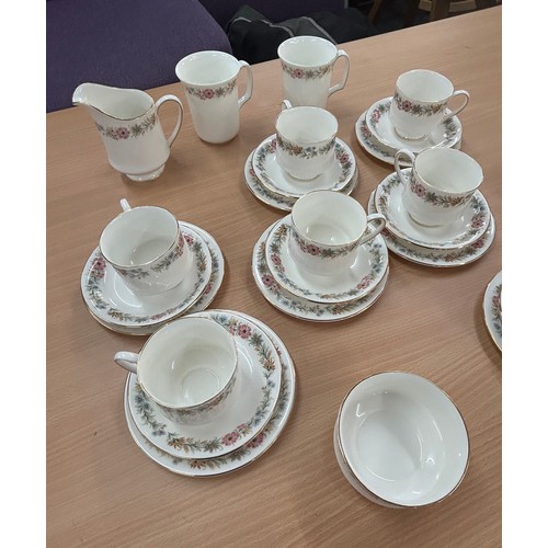 557 - Royal Albert Paragon Belinda part tea service to include cups, saucers, milk jug etc