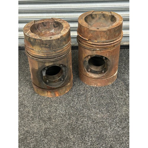 243 - Pair of large engine pistons measures approx 15.5 inches tall by 10 inches wide