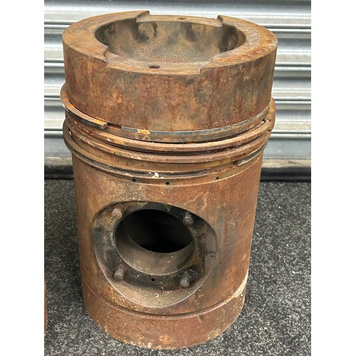 243 - Pair of large engine pistons measures approx 15.5 inches tall by 10 inches wide