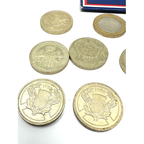 421 - 12 collectors two pound coins