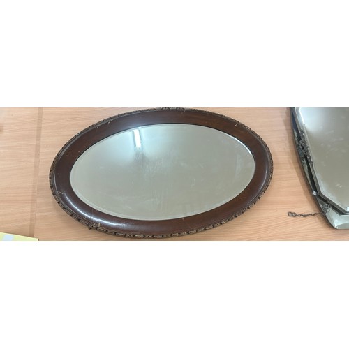 79 - Oval oak framed mirror measures approximately 32 inches wide 21 inches tall