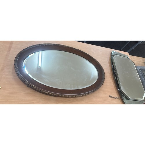 79 - Oval oak framed mirror measures approximately 32 inches wide 21 inches tall