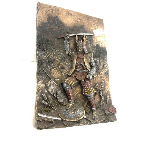 67 - Bronzed plaque depicting a Samuri Warrior measures approx 12 inches long by 8 pieces wide