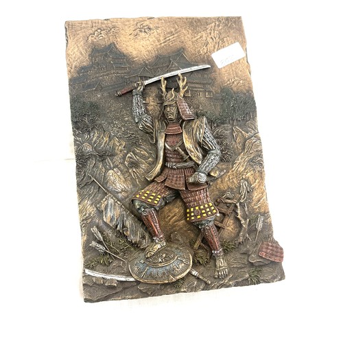 67 - Bronzed plaque depicting a Samuri Warrior measures approx 12 inches long by 8 pieces wide