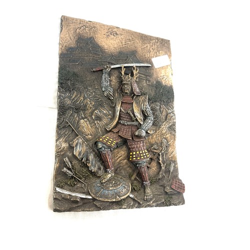 67 - Bronzed plaque depicting a Samuri Warrior measures approx 12 inches long by 8 pieces wide