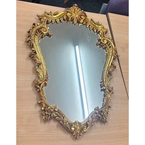 62 - Vintage gilt framed mirror measures approximately 28 inches by 19 inches