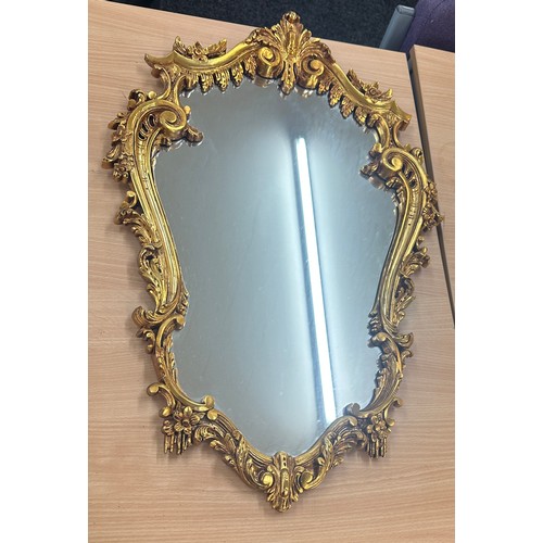 62 - Vintage gilt framed mirror measures approximately 28 inches by 19 inches