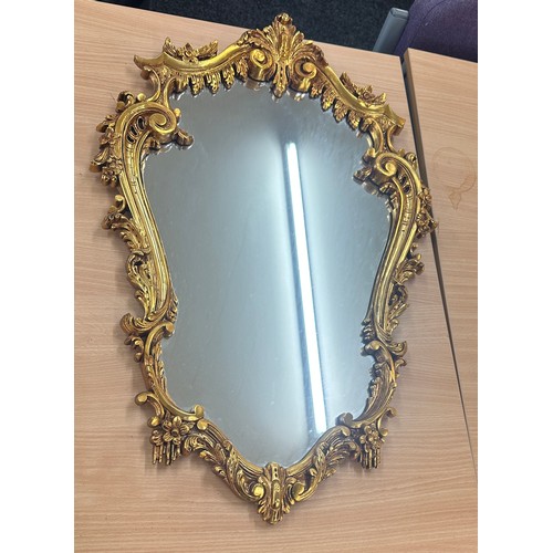 62 - Vintage gilt framed mirror measures approximately 28 inches by 19 inches