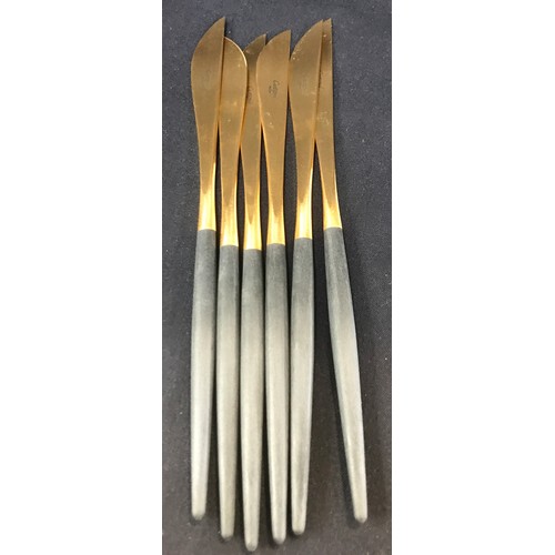 552 - Boxed 24 place setting Cutipol cutlery matte black and gold plated