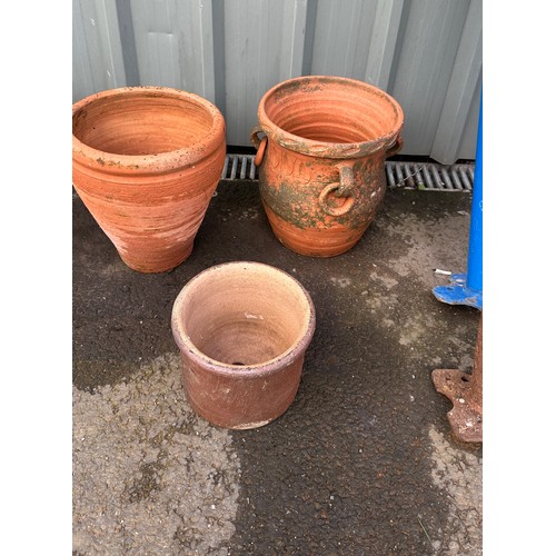 100V - three terracotta plant pots largest measures approx 12 inches tall by 11 inches diameter