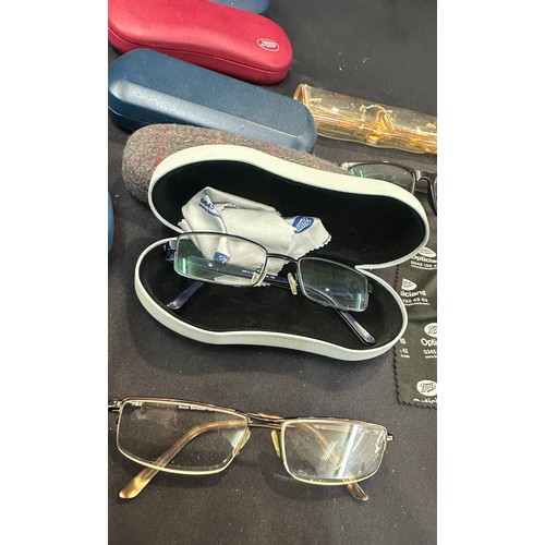 102 - Selection of cased prescriptions glasses men and womens