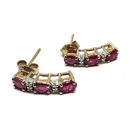 114 - 9ct gold diamond & ruby earrings (1.6g)