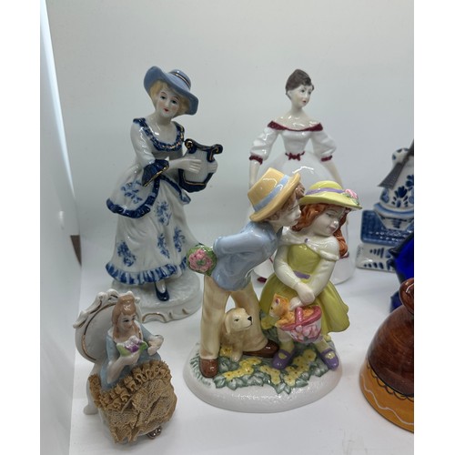 201 - Selection of vintage porcelain figures one signed, and two glass fish