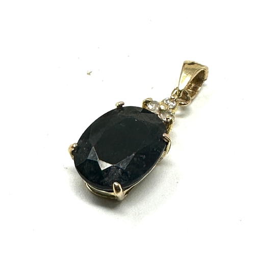 104 - 9ct gold sapphire & diamond pendant weight .09 g