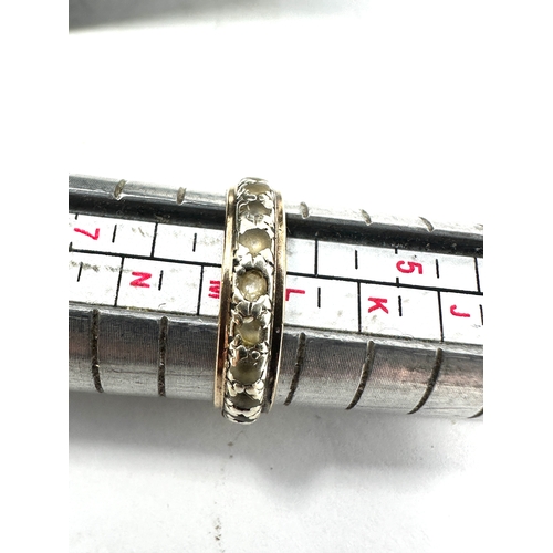 102 - 9ct gold & stone set eternity ring weight 1.8g