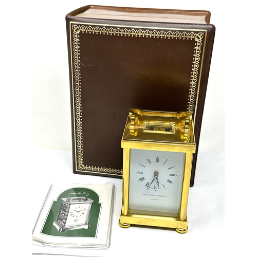 412 - Boxed Matthew Norman brass carriage clock  the clock is ticking complete with the key