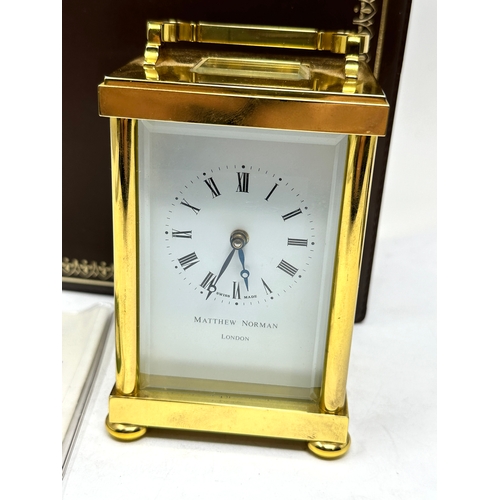 412 - Boxed Matthew Norman brass carriage clock  the clock is ticking complete with the key