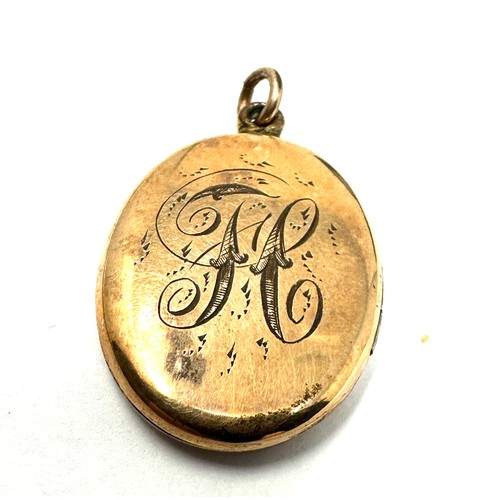 97 - 9ct gold back & front engraved locket (6.6g)