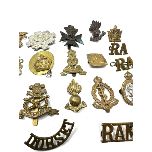 563 - selection  military cap badges etc