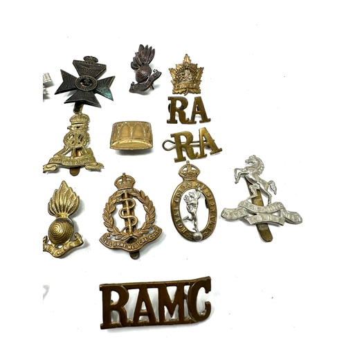 563 - selection  military cap badges etc