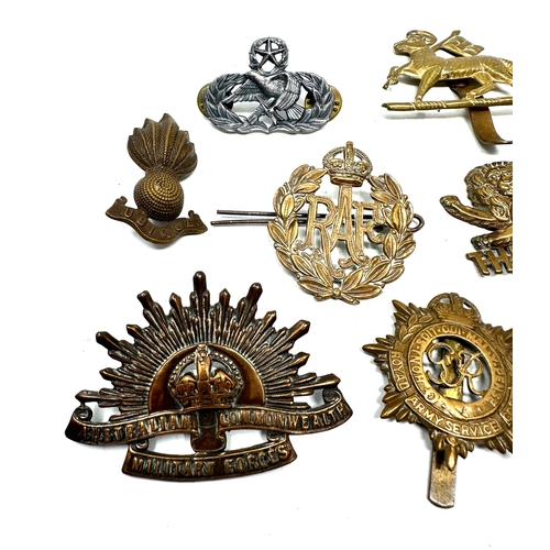 568 - selection of military cap badges