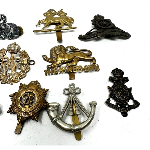 568 - selection of military cap badges