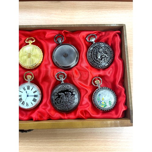 452 - Wooden showcase containing 20 pocket watches, all untested