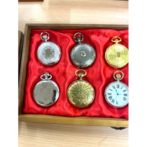 452 - Wooden showcase containing 20 pocket watches, all untested