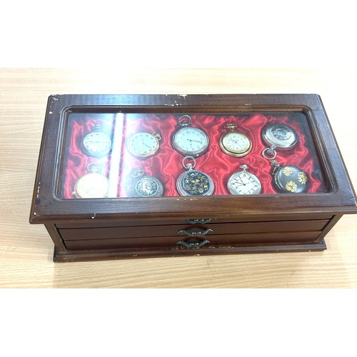 451 - Wooden showcase containing 28 pocket watches, all untested