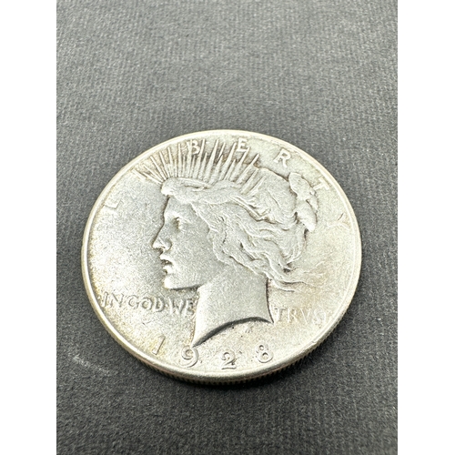 679 - 1928 silver peace dollar