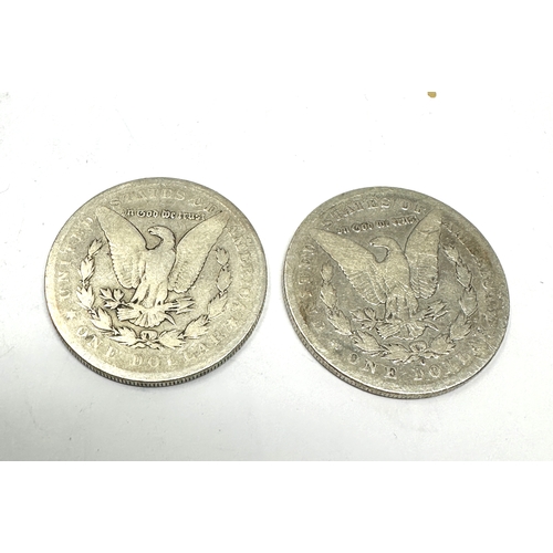 697 - 2 silver morgan dollars 1897 & 1884