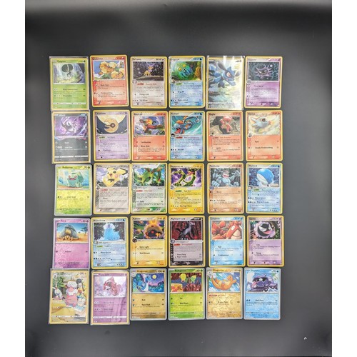 583 - A collection of 30 Pokémon cards, some carefully sleeved and sourced from various series 2006-2022 
... 