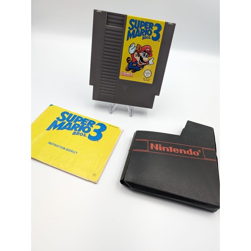 86 - Introducing Nintendo memorabilia featuring Super Mario Bros 3 for NES console with the original manu... 